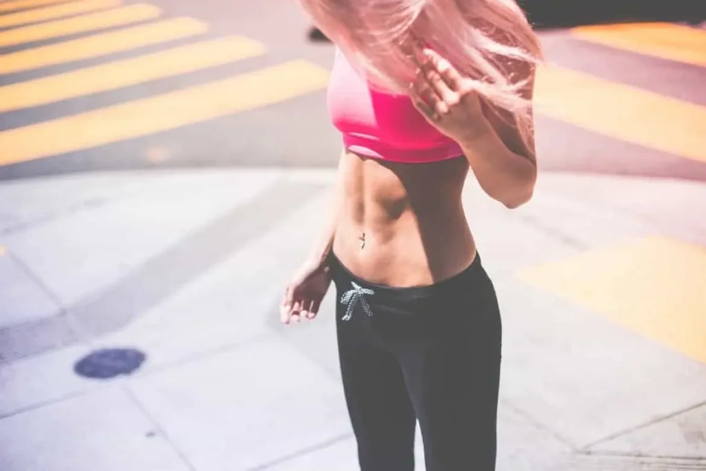 Woman with toned stomach after LA-EMS Body Sculpting Treatment Streatham
